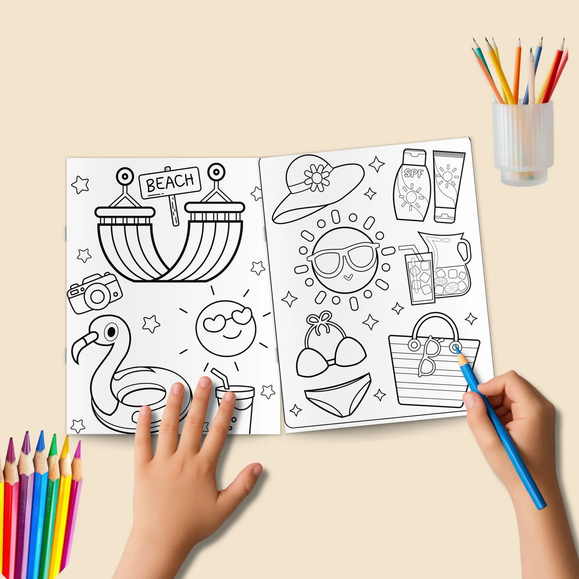 A black and white summer coloring page of a sandcastle on a beach with a smiling sun and fluffy clouds."